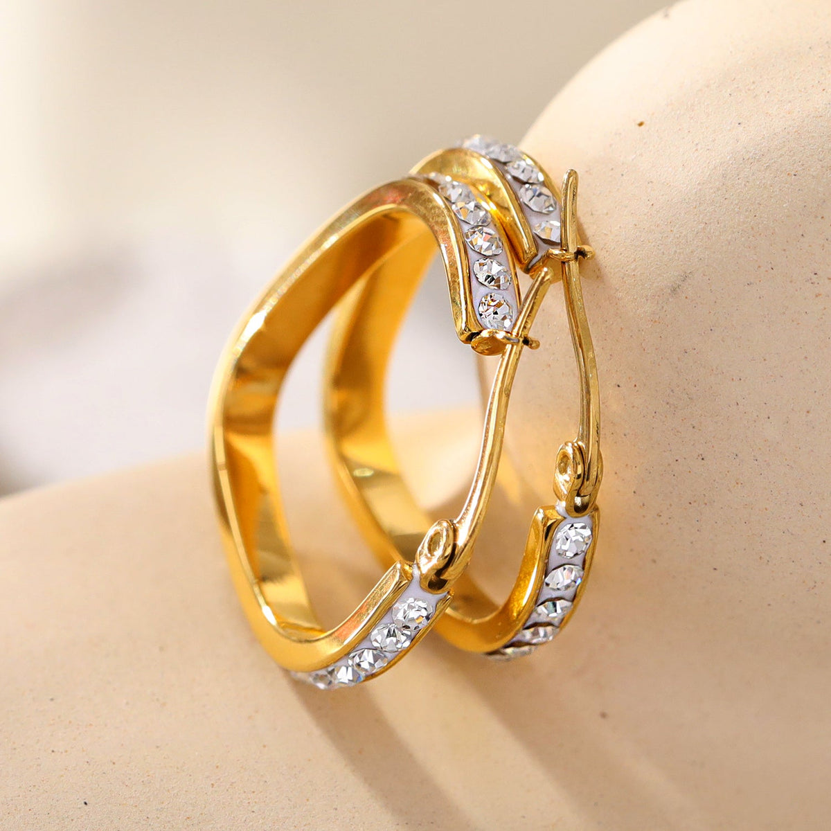 Style MELFI Gold: Abstract Heart Shaped Hoops embedded with Zirconia Gemstones
