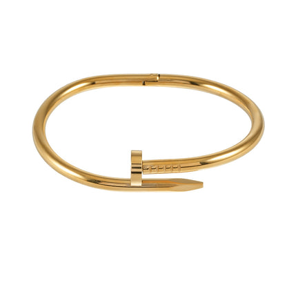 AGOTA Gold: Industrial-Chic Twisted Nail Bracelet