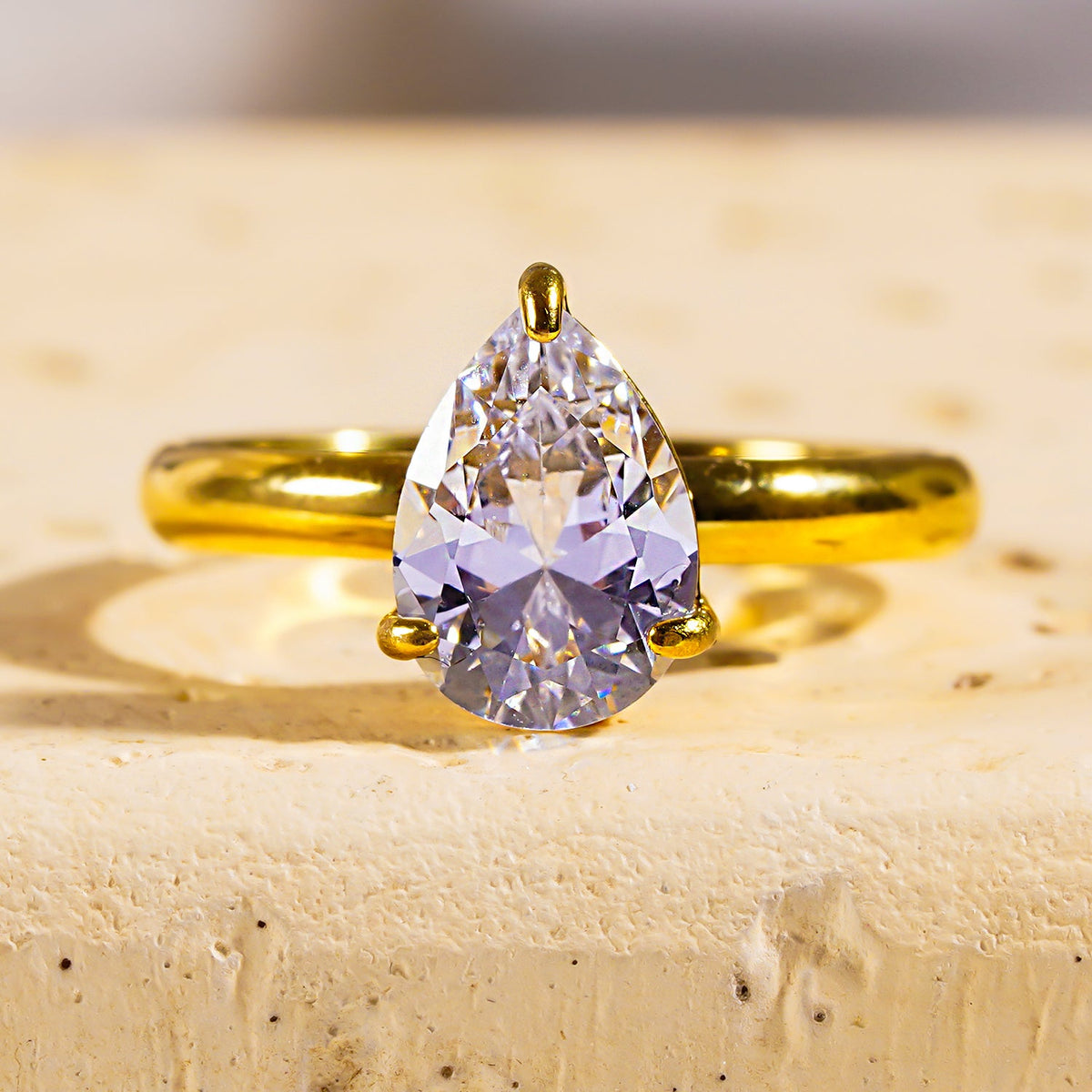 DIMONDA: Classic Gold Ring with Prominent Teardrop Zirconia Centerpiece