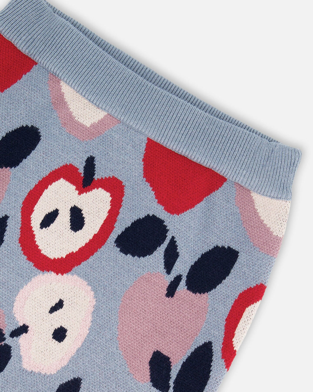 Jupe en maille bleue et rouge avec jacquard cœur et pomme