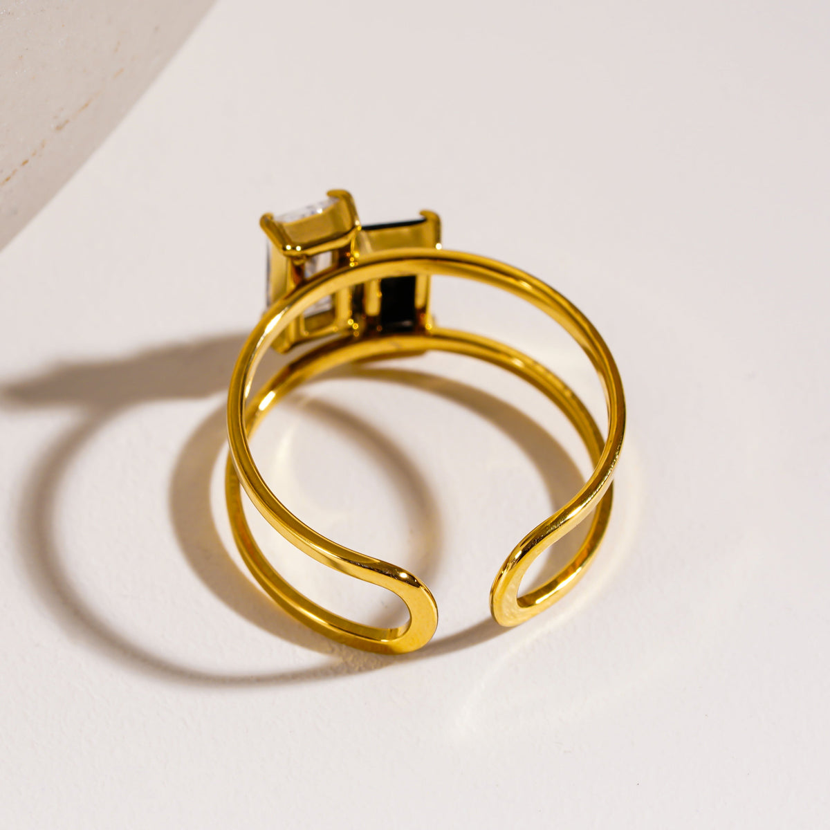 RIADEL: Dual-Radiance Black & Clear Zirconia Banded Ring